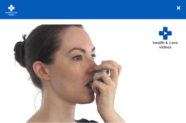 woman using an inhaler