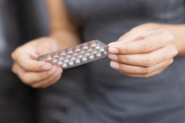 lady holding the combined pill