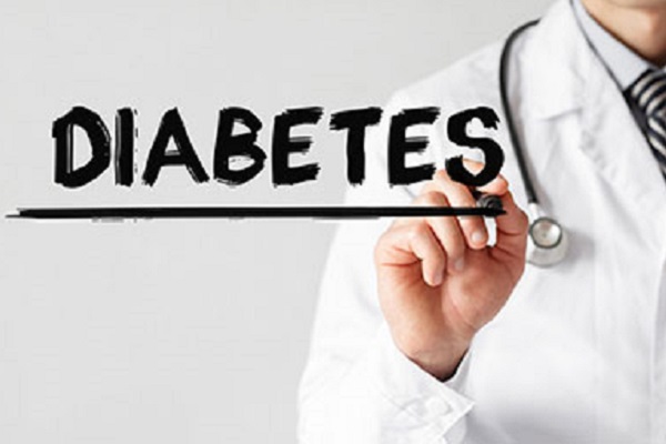 Doctor writing the word Diabetes