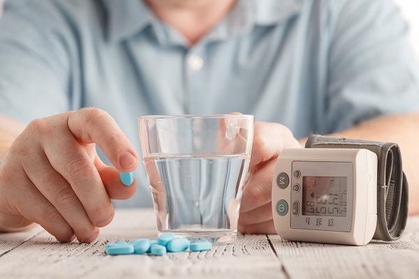 Blood pressure cuff and pills